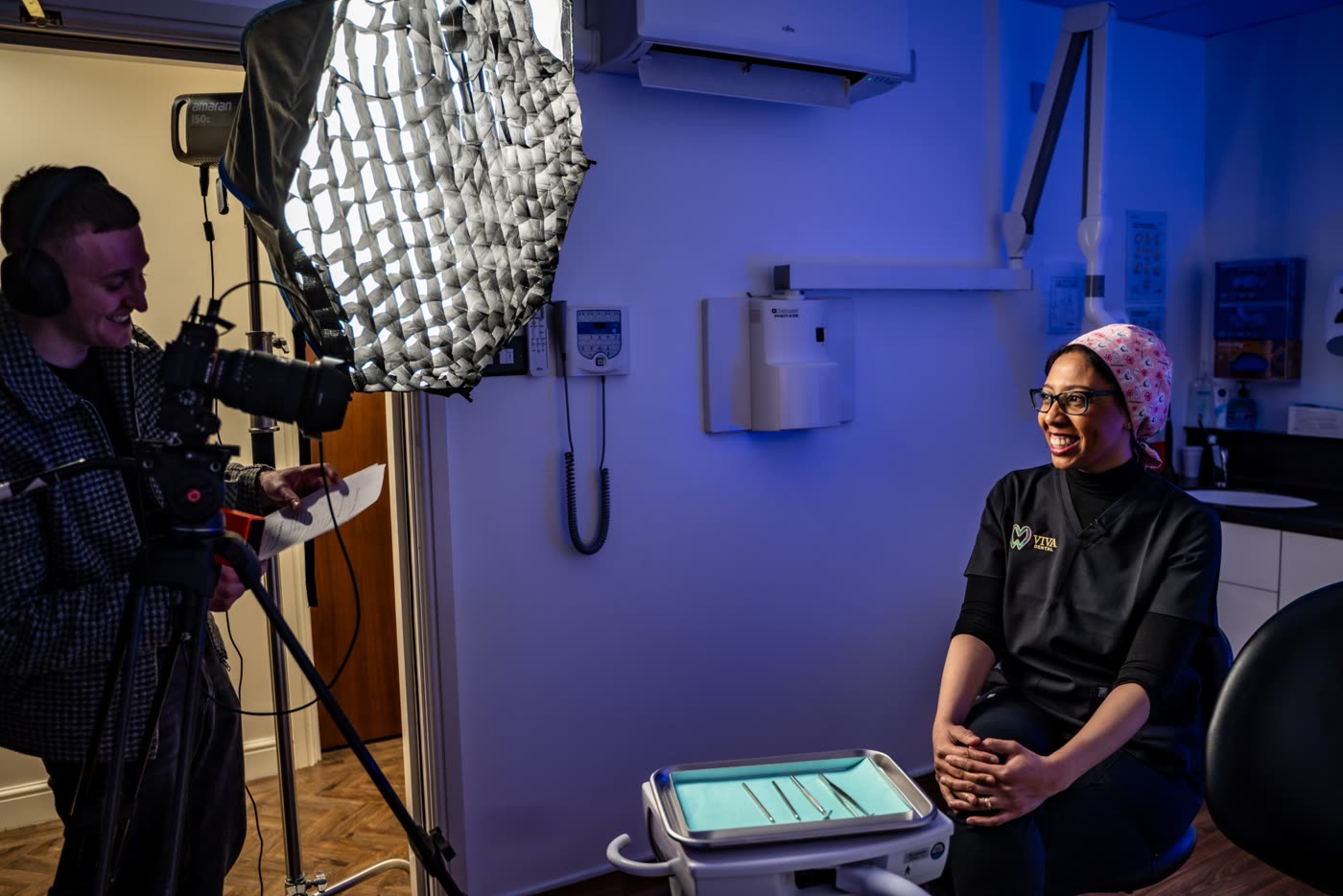 Louie filming a dentist in her surgery under a softbox