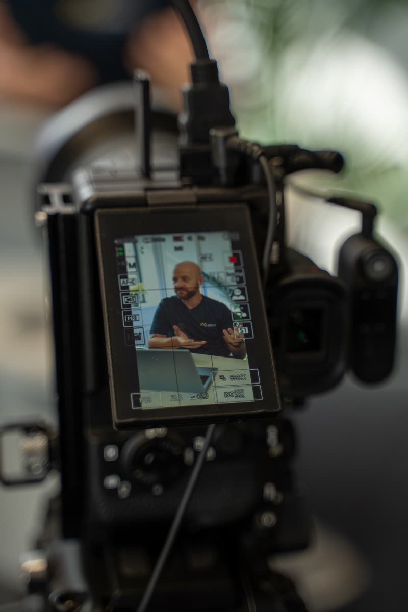 Camera screen showing a mortgage broker mid-interview
